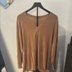 SKIMS tan sleep shirt.